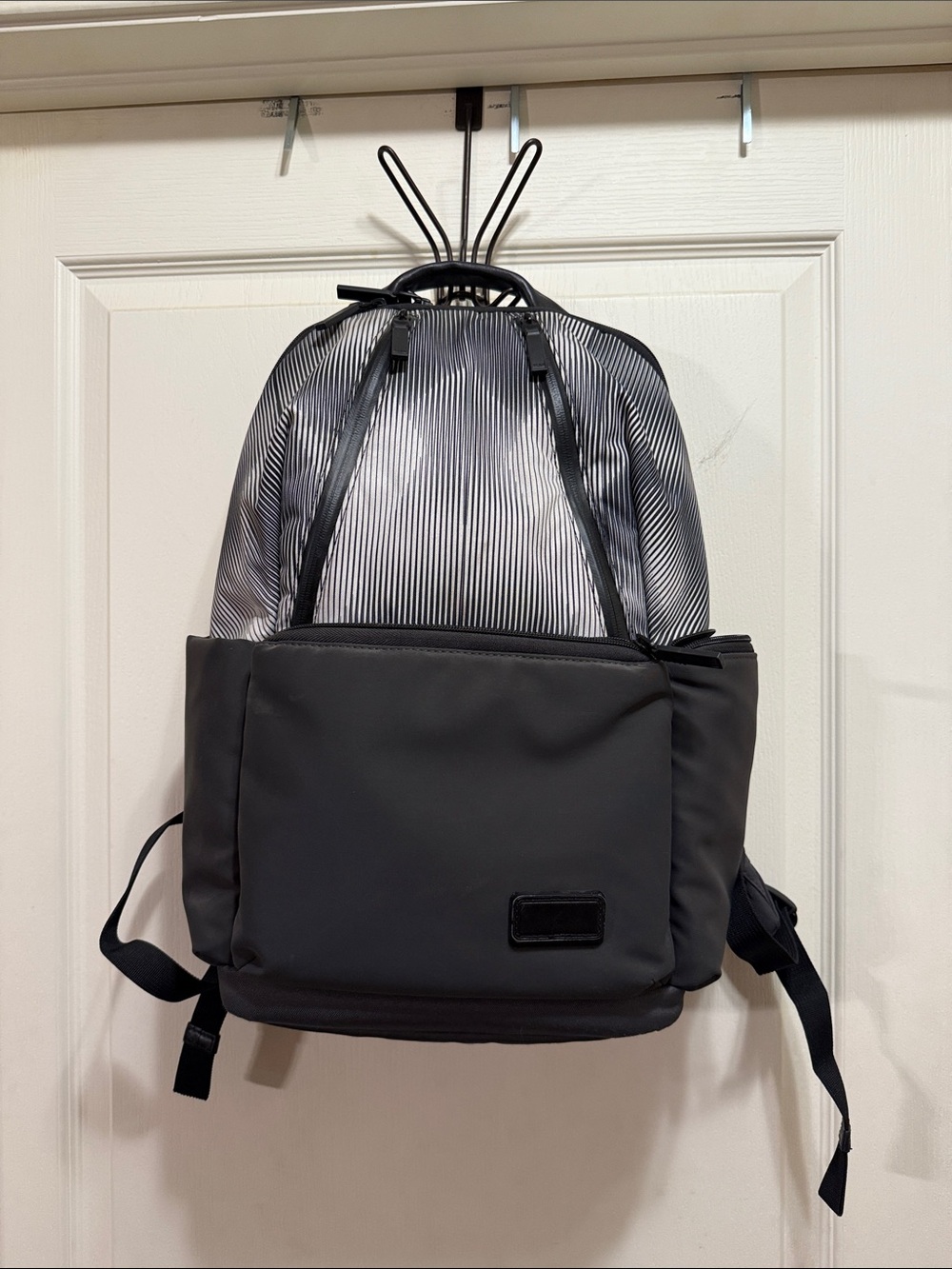 Tumi Black Backpack with Gray Pinstripe Upper